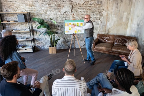 Preview: Senior businessman discussing strategy with new startup project .
