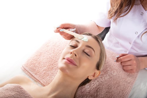 Preview: Woman receiving facial treatment at spa