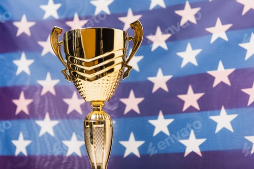 Preview: golden cup with stars of american flag on blurred background
