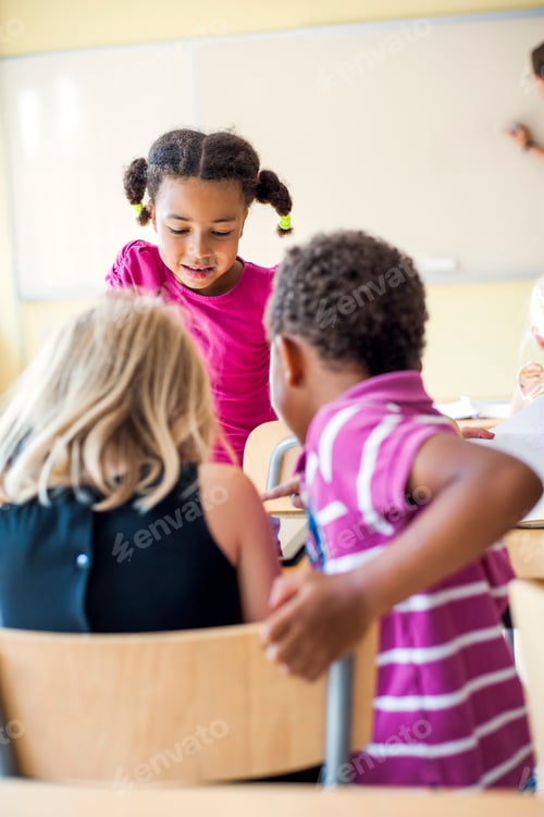 Preview: Children studying in classroom