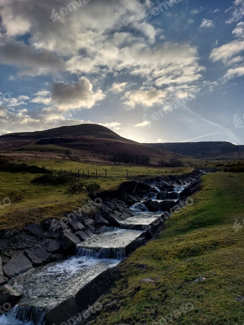 Preview: cloudy sky, welsh hills and downhill stream