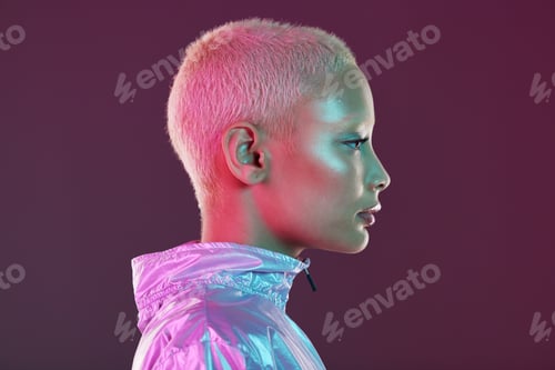 Preview: Holographic fashion, woman face and glow for hologram trend isolated on a studio background. Futuri