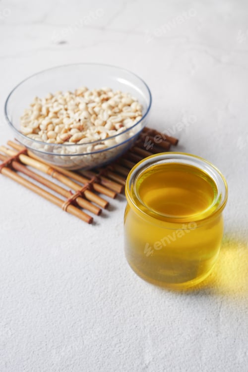Preview: overhead shot view peanuts and oils in a container
