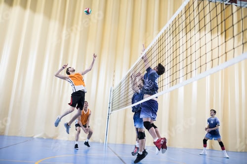 Preview: Man jumping during a volleyball match
