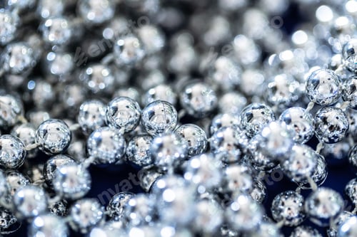 Preview: close up of silver beads. christmas and holiday decoration concept