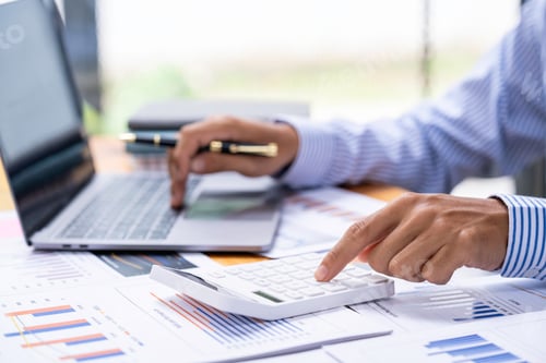 Preview: Accountant doing finance and calculate about cost on the desk at home office, close up hands of acco