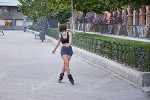 Preview: Woman Rollerblading on Gray Pavement in Urban Park