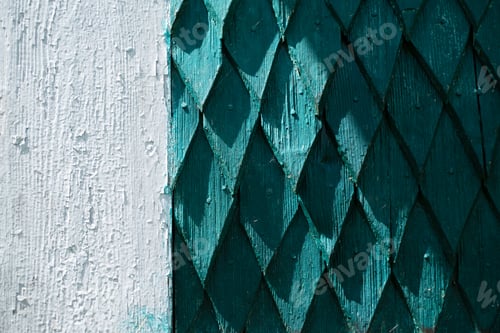 Preview: The wall of the house is made of old wood. Wooden details in the form of a rhombus.