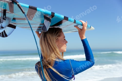 Preview: Caucasian woman during surf session at beach