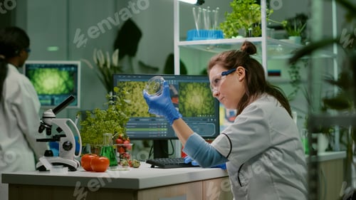 Preview: Botanist researcher typing medical expertise on computer