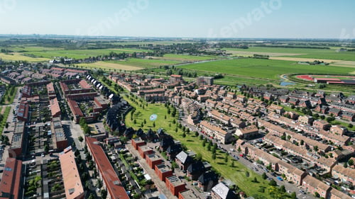 Preview: Drone shot of the Assendelft town with houses and streets in The Netherlands with horizon sky