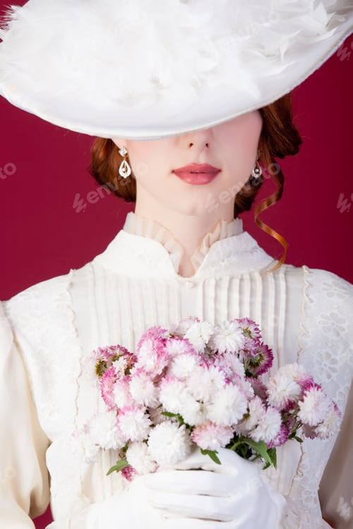 Preview: photo of beautiful young woman in vintage dress with cute bunch of flowers