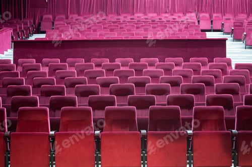 Preview: Empty red chairs for audience in the theater