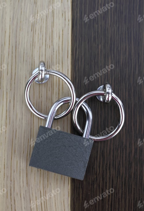 Preview: Closed padlock on wooden door