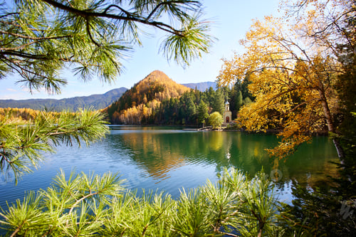 Preview: Beautiful autumn landscape. Orthodox chapel on the shore of the Emerald Lake.