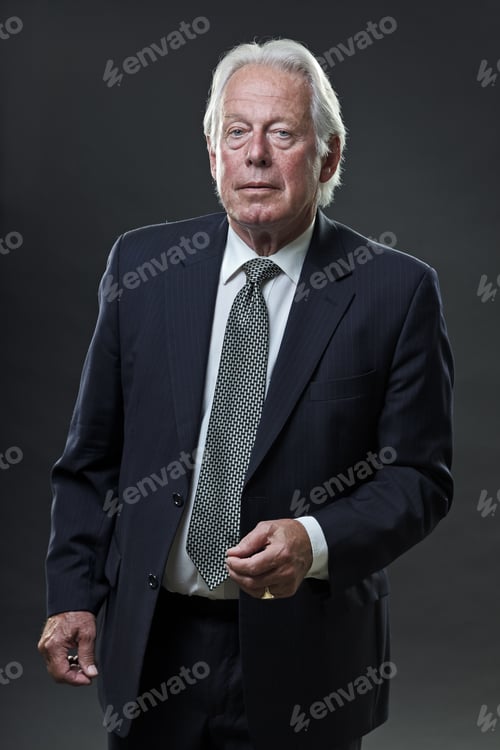 Preview: Studio Portrait Of Senior Business Man Looking Serious.