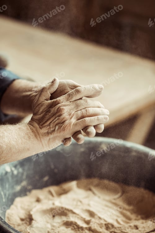 Preview: Close up of Male Potter Hands Taking Clay From A Bowl