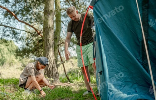Preview: Father And Daughter Setting Up A Tent