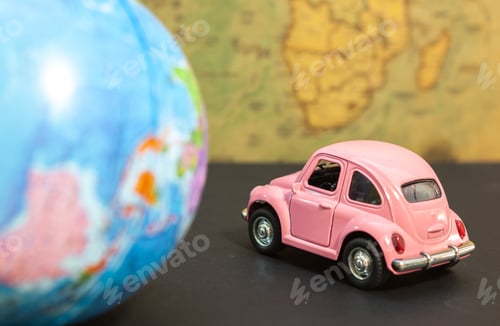 Preview: Traveling as a lifestyle. Pink car and globe