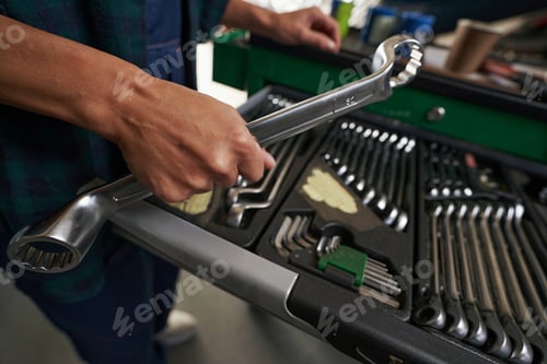Preview: Mechanic toolbox with metal equipments in aircraft hangar