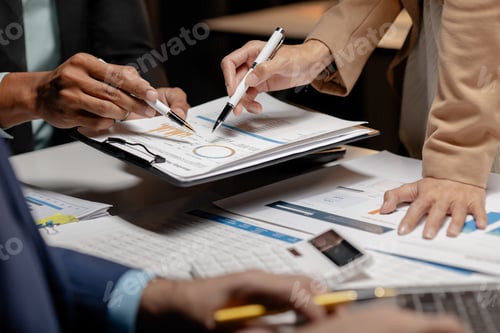 Preview: A meeting is taking place in a conference room where three employees are discussing important inform