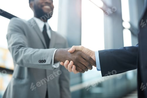 Preview: Unrecognizable Men Shaking Hands