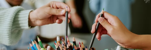 Preview: Closeup of Diverse Children Reaching for Colored Pencils during Art Activity