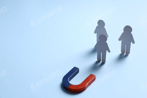 Preview: Magnet attracting paper people on light blue background, space for text. Business rivalry concept