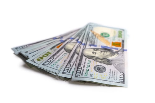 Preview: Hundred Dollar Bills Stacked Neatly on White Surface