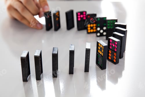 Preview: Man Hands playing domino on shiny desk