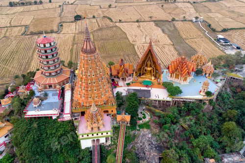 Preview: Aerial view of Sunrise on golden temple or Wat Tham Sua at Kanchanaburi