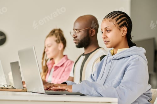 Preview: Group of programmers working on computers