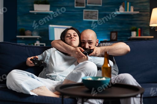 Preview: Determinated enthusiastic couple winning video games