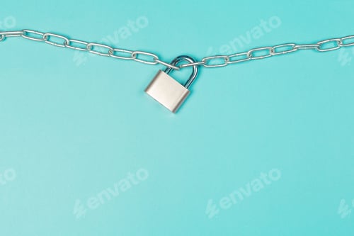 Preview: Lock secured on a chain against a simple blue background