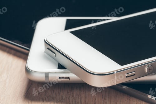 Preview: Digital tablet and mobile phone. Electronic devices on wooden table, close up