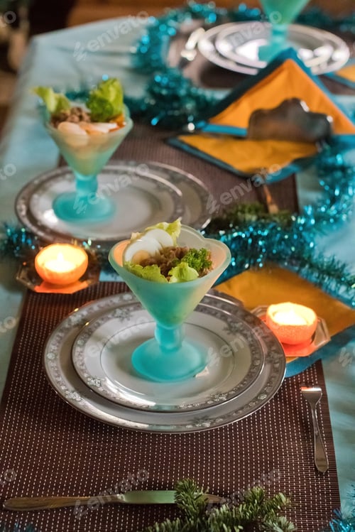 Preview: Festively served table, anticipation of Christmas, sea salad in turquoise bowls
