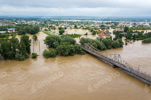 Preview: Aerial view of flooded houses with dirty water of Dnister river in Halych town, western Ukraine