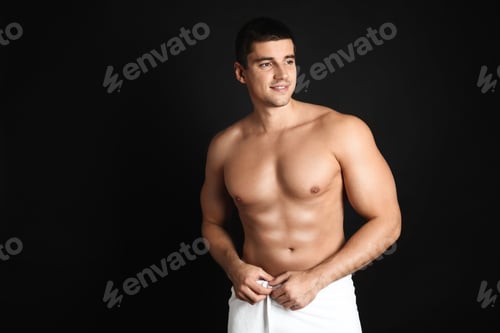 Preview: Man with sexy body on black background. Space for text