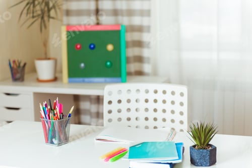 Preview: Schoolboy workplace at home table, chair and books