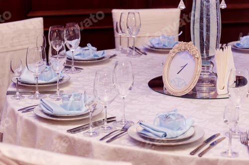 Preview: luxury wedding arrangement of stylish glasses plates on napkins and silver cutlery