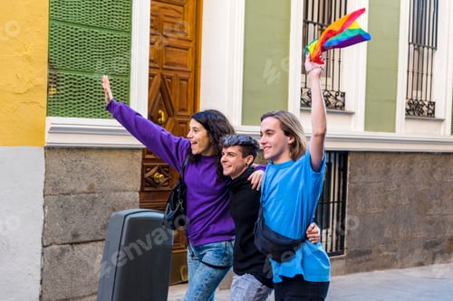 Preview: Young diverse friends walking on the street with pride rainbow flag.