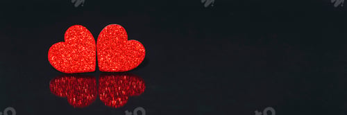 Preview: Two red hearts with reflection on black background. Valentines day concept. Copy space