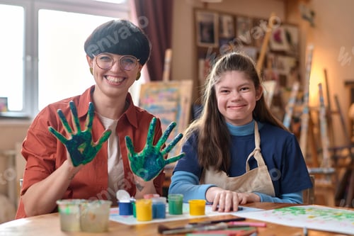 Preview: Girl with Disability Smiling at Camera with Cheerful Teacher