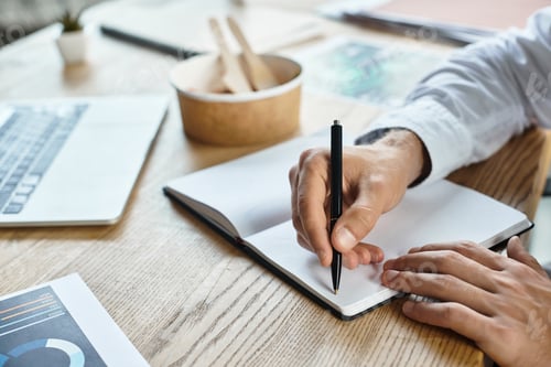 Preview: A focused man in a white shirt creates ideas at a modern office desk