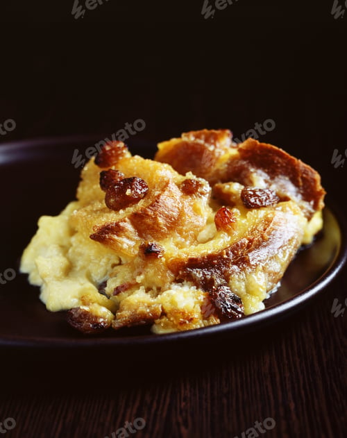 Preview: Scoop of bread and butter pudding on plate