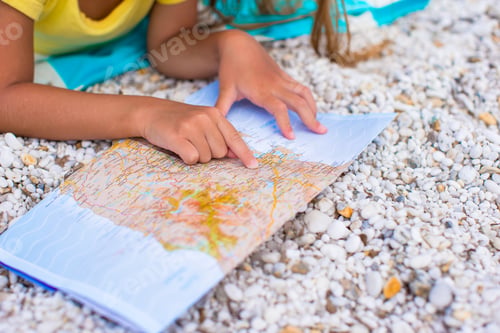 Preview: Adorable little girl with map find the way on tropical beach vacation