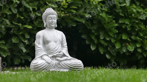 Preview: Closeup of a Buddha sculpture in a park