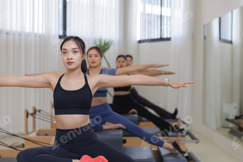 Preview: Women training core strength doing pilates class