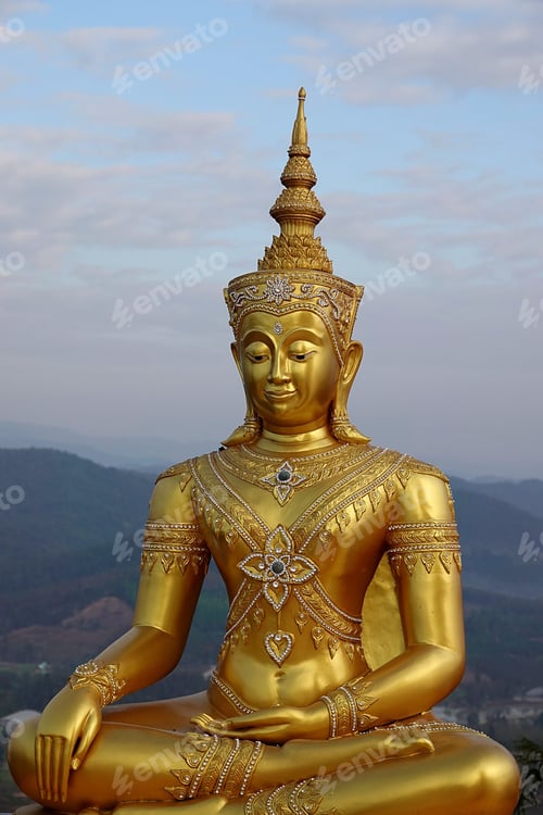 Preview: Vertical aerial view of big golden Buddha statue on the top of a mountain