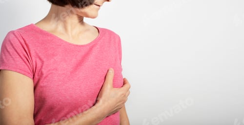 Preview: Middle aged caucasian woman doing breast self examination